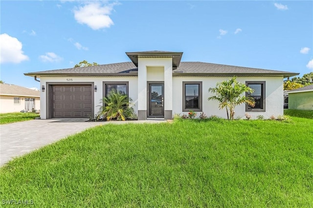 5215 7th St W, Lehigh Acres, FL 33971 - prairie-style house with an attached garage, driveway, stucco siding, and a front lawn