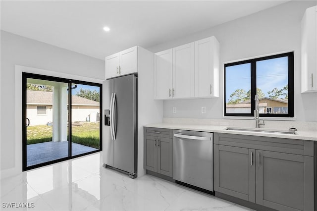 5215 7th St W, Lehigh Acres, FL 33971 - kitchen featuring appliances with stainless steel finishes, gray cabinetry, a sink, light countertops, and recessed lighting