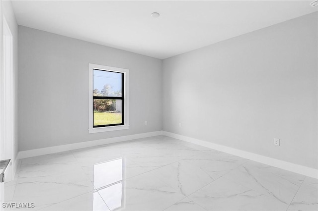 5215 7th St W, Lehigh Acres, FL 33971 - unfurnished room with light marble finish floors and baseboards