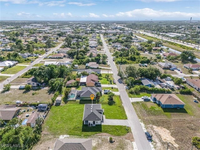 5215 7th St W, Lehigh Acres, FL 33971 - aerial view of property and surrounding area with nearby suburban area