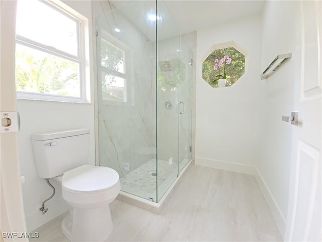 687 Grove Dr, Naples, FL 34120 - bathroom featuring a marble finish shower, baseboards, and toilet