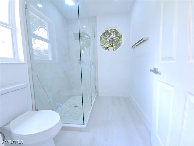687 Grove Dr, Naples, FL 34120 - bathroom with healthy amount of natural light, a marble finish shower, and toilet