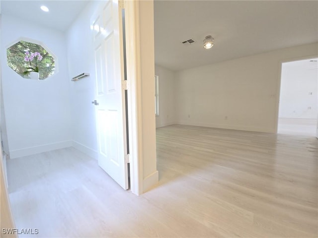 687 Grove Dr, Naples, FL 34120 - corridor featuring light wood-style floors, baseboards, and recessed lighting
