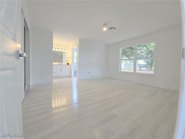687 Grove Dr, Naples, FL 34120 - empty room with light wood-style floors
