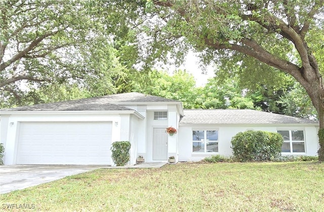 687 Grove Dr, Naples, FL 34120 - view of front facade with a garage, concrete driveway, a shingled roof, a front lawn, and stucco siding