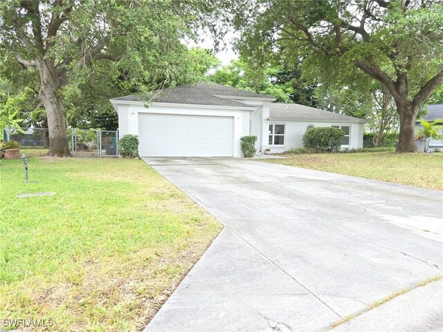 687 Grove Dr, Naples, FL 34120 - ranch-style house featuring concrete driveway, an attached garage, roof with shingles, and stucco siding