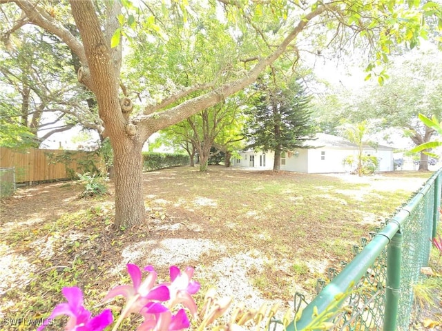 687 Grove Dr, Naples, FL 34120 - view of yard featuring fence