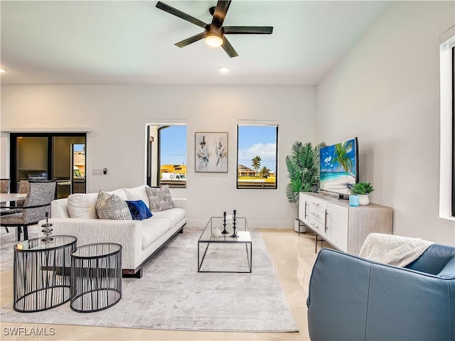 living room with ceiling fan and recessed lighting