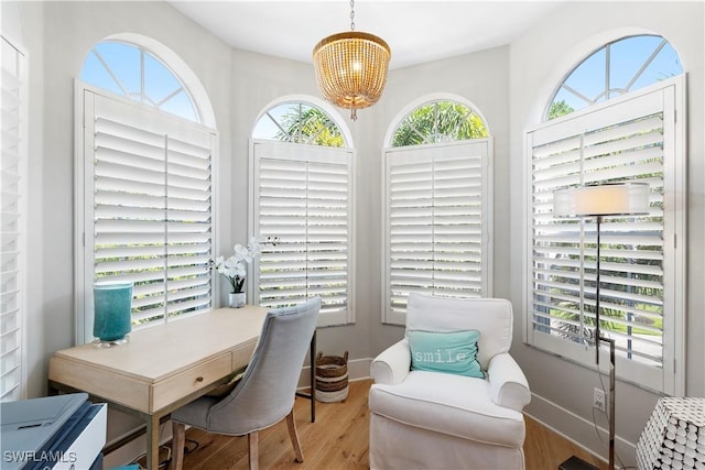 838 9th Ave S Unit 106, Naples, FL 34102 - home office with a chandelier and wood finished floors
