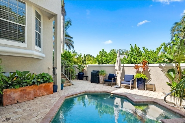 838 9th Ave S Unit 106, Naples, FL 34102 - view of pool with a patio area and a fenced backyard