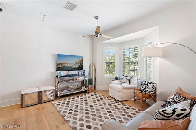 838 9th Ave S Unit 106, Naples, FL 34102 - living area featuring light wood-style floors, baseboards, and ceiling fan