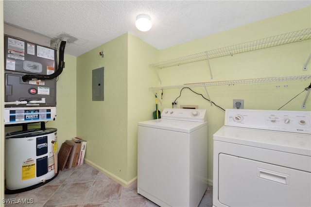 laundry room featuring separate washer and dryer, baseboards, electric panel, water heater, and a textured ceiling