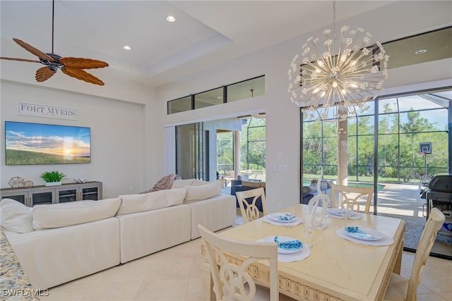 8336 Adelio Ln, Fort Myers, FL 33912 - dining room with light tile patterned floors, a towering ceiling, a chandelier, recessed lighting, and a ceiling fan