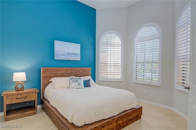 8336 Adelio Ln, Fort Myers, FL 33912 - tiled bedroom featuring baseboards