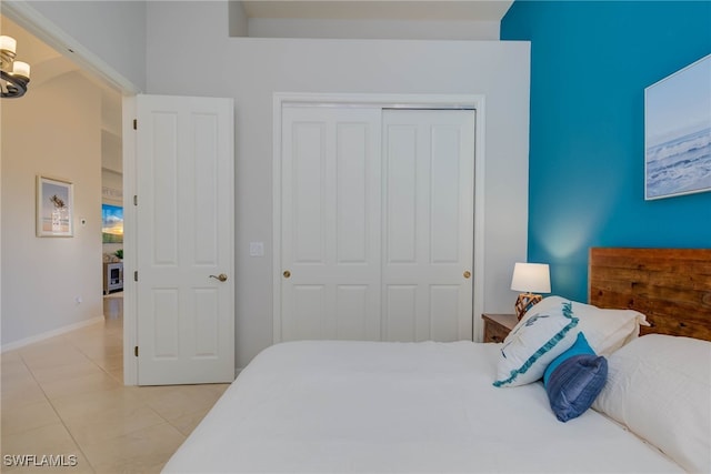 8336 Adelio Ln, Fort Myers, FL 33912 - bedroom featuring light tile patterned floors, a closet, and baseboards