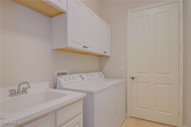 8336 Adelio Ln, Fort Myers, FL 33912 - laundry room featuring cabinet space, washer and dryer, and light tile patterned flooring