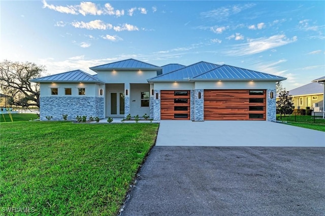 6100 Riverside Dr, Punta Gorda, FL 33982 - view of front facade featuring a standing seam roof, driveway, stone siding, and a front lawn