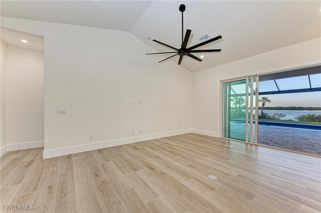6100 Riverside Dr, Punta Gorda, FL 33982 - spare room featuring vaulted ceiling, light wood-type flooring, a ceiling fan, recessed lighting, and baseboards