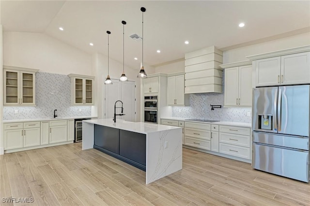 6100 Riverside Dr, Punta Gorda, FL 33982 - kitchen featuring stainless steel appliances, custom exhaust hood, decorative backsplash, glass insert cabinets, and lofted ceiling