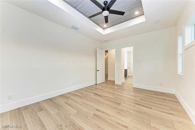 6100 Riverside Dr, Punta Gorda, FL 33982 - unfurnished bedroom featuring a raised ceiling, baseboards, light wood-type flooring, and recessed lighting