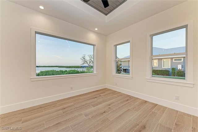 6100 Riverside Dr, Punta Gorda, FL 33982 - empty room with light wood-style flooring, baseboards, and recessed lighting