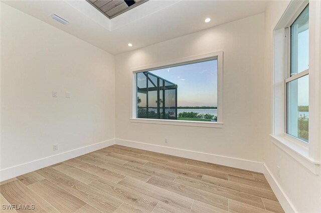 6100 Riverside Dr, Punta Gorda, FL 33982 - unfurnished room with light wood-style flooring, recessed lighting, and baseboards