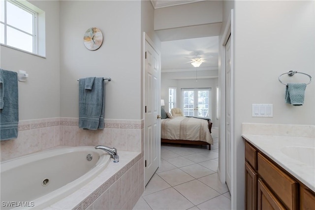 6659 Castlelawn Pl Unit 21, Naples, FL 34113 - ensuite bathroom featuring crown molding, a whirlpool tub, vanity, tile patterned flooring, and ceiling fan