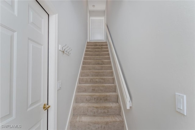 6659 Castlelawn Pl Unit 21, Naples, FL 34113 - staircase featuring baseboards
