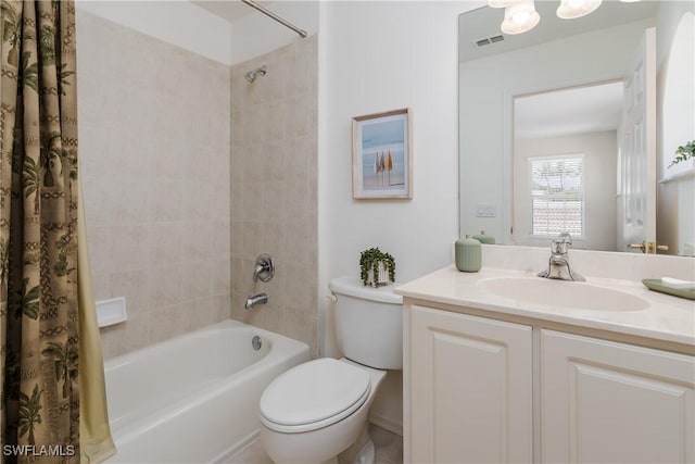 6659 Castlelawn Pl Unit 21, Naples, FL 34113 - full bathroom featuring shower / bath combo, toilet, and vanity
