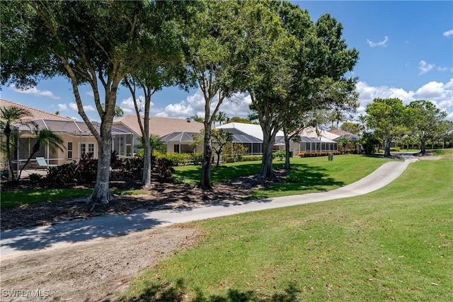 6659 Castlelawn Pl Unit 21, Naples, FL 34113 - view of home's community with a yard and a residential view