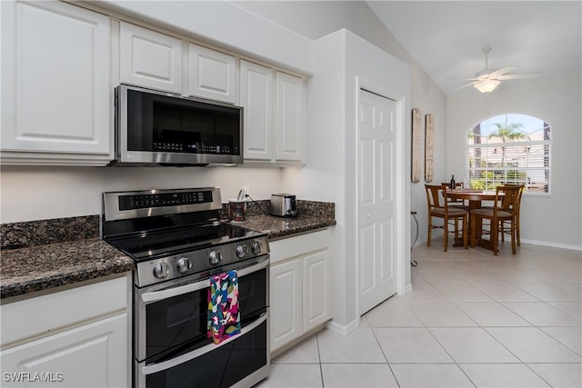 6659 Castlelawn Pl Unit 21, Naples, FL 34113 - kitchen with appliances with stainless steel finishes, baseboards, light tile patterned flooring, a ceiling fan, and white cabinets