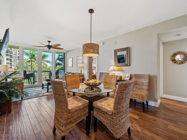 140 Seaview Ct Unit 206N, Marco Island, FL 34145 - dining room featuring wood finished floors, baseboards, expansive windows, and a ceiling fan