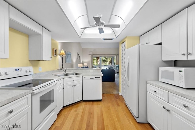 664 Wiggins Bay Dr, Naples, FL 34110 - kitchen featuring white appliances, a sink, ceiling fan, light wood finished floors, and light countertops
