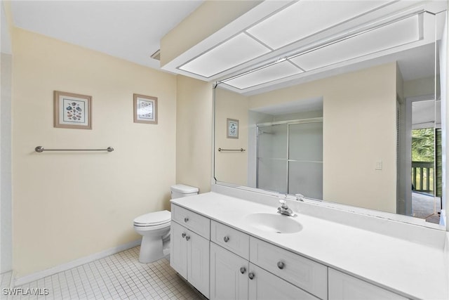 664 Wiggins Bay Dr, Naples, FL 34110 - full bathroom with baseboards, a shower stall, toilet, vanity, and tile patterned floors