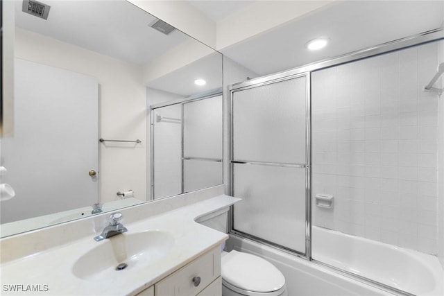 664 Wiggins Bay Dr, Naples, FL 34110 - bathroom with toilet, vanity, bath / shower combo with glass door, and recessed lighting
