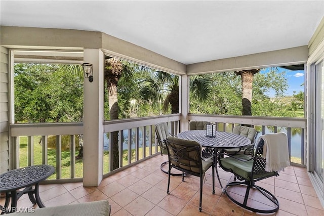 664 Wiggins Bay Dr, Naples, FL 34110 - sunroom with outdoor dining space