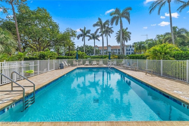 664 Wiggins Bay Dr, Naples, FL 34110 - community pool featuring fence and a patio area