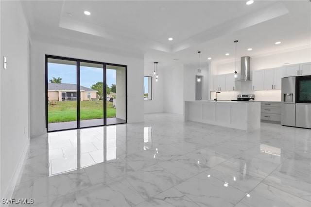 2712 58th St W, Lehigh Acres, FL 33971 - unfurnished living room featuring a tray ceiling, a sink, recessed lighting, light marble finish flooring, and baseboards