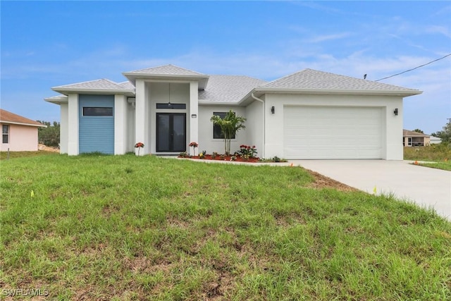 2712 58th St W, Lehigh Acres, FL 33971 - prairie-style home with a front lawn, driveway, a garage, and stucco siding