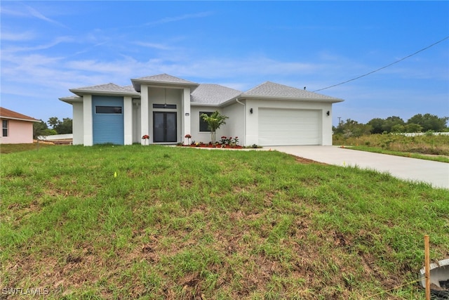 2712 58th St W, Lehigh Acres, FL 33971 - prairie-style home with an attached garage, a front lawn, concrete driveway, and stucco siding