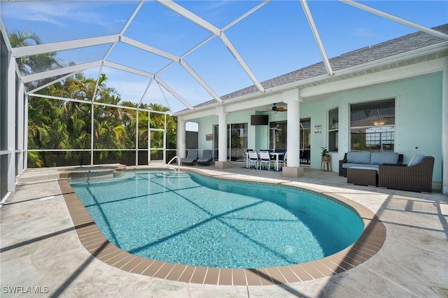 view of pool featuring a patio, a ceiling fan, an outdoor hangout area, and a lanai