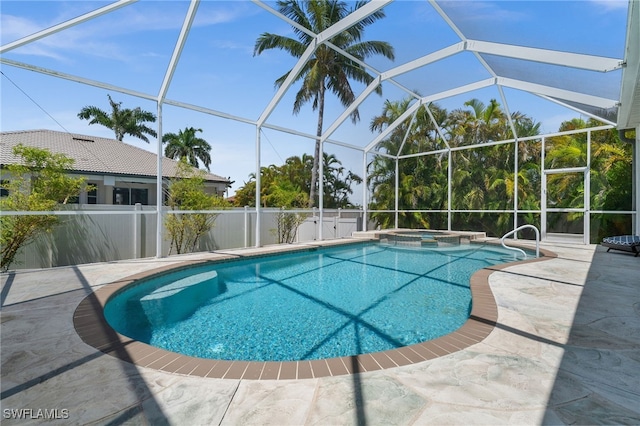 view of swimming pool with a patio area, a lanai, and a pool with connected hot tub