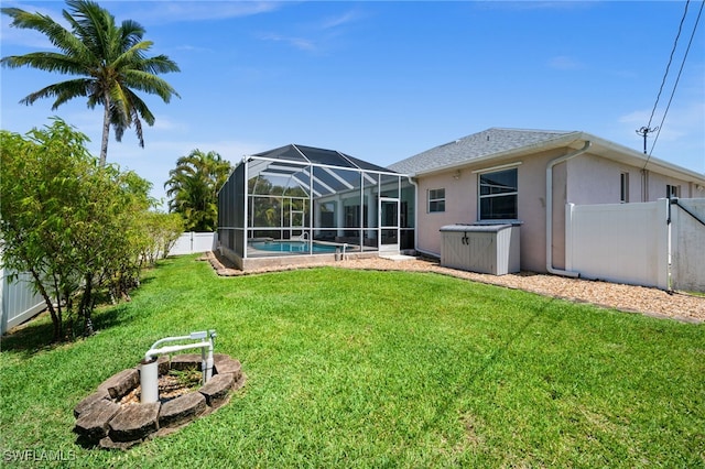 view of yard featuring an outdoor pool and a lanai