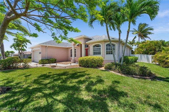 single story home with stucco siding and a garage
