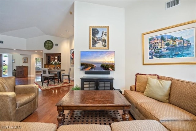 600 Port Side Dr, Naples, FL 34103 - living room featuring wood finished floors and vaulted ceiling