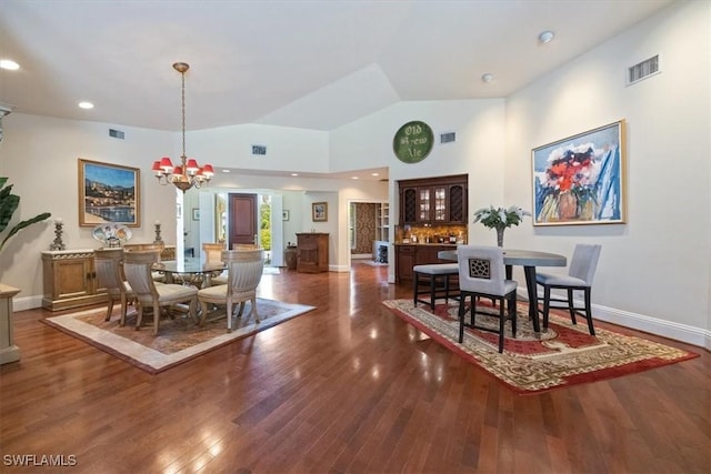 600 Port Side Dr, Naples, FL 34103 - dining room featuring wood finished floors, a chandelier, vaulted ceiling, baseboards, and recessed lighting