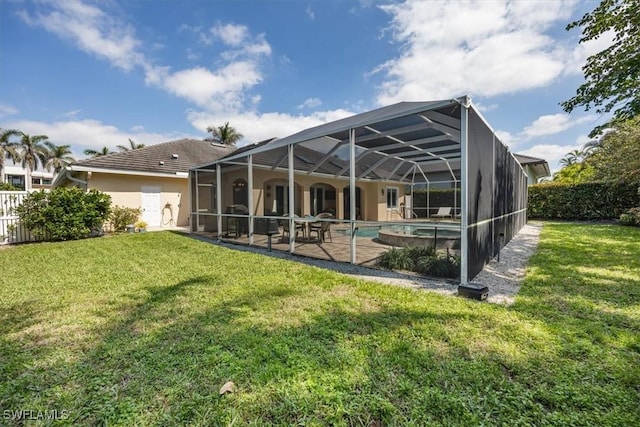 600 Port Side Dr, Naples, FL 34103 - rear view of house with stucco siding and a patio area