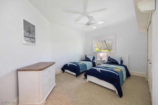 600 Port Side Dr, Naples, FL 34103 - bedroom with light colored carpet, baseboards, and ceiling fan