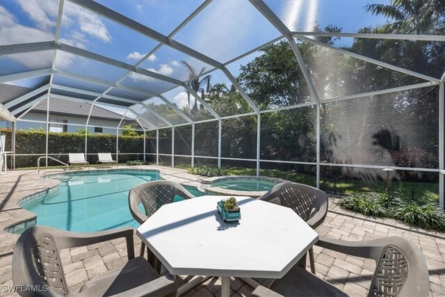 600 Port Side Dr, Naples, FL 34103 - view of swimming pool featuring a patio, a pool with connected hot tub, and a lanai