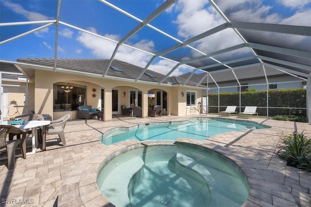 600 Port Side Dr, Naples, FL 34103 - view of swimming pool with a pool with connected hot tub, a patio area, and glass enclosure